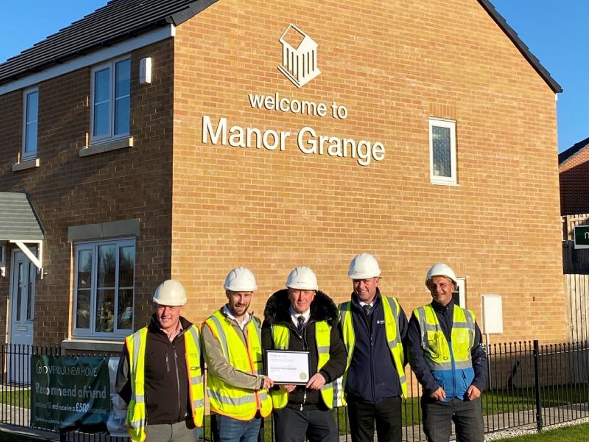 Members Of The Persimmon Homes Manor Grange Team Receiving The Premier Guarantee Award