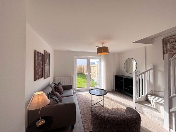 Bright lounge with garden access in new-build home at Trevithick Manor Park.