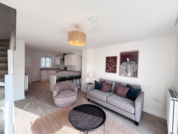 Bright lounge with garden access in new-build home at Trevithick Manor Park.