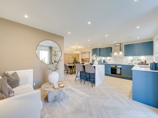 Open-plan kitchen in The Burnham at Bluebell Meadow with island and dining area.