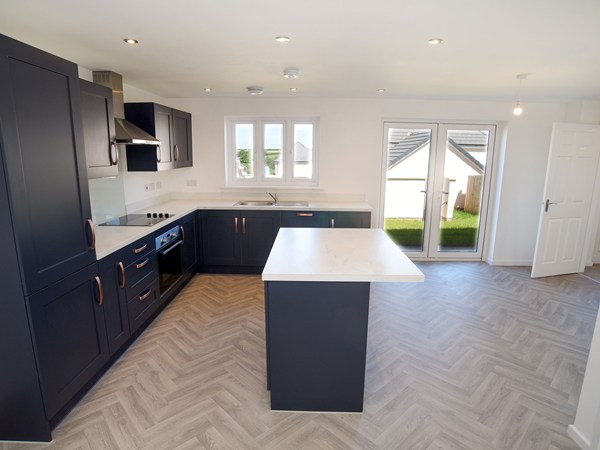 Open-plan kitchen and dining area in the Brampton at Trehenlis Gardens.