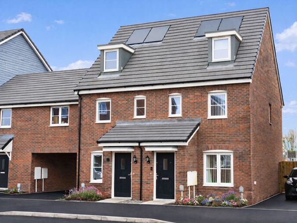 Modern red‑brick semi‑detached homes with dormer windows on a new Hawthorn Park street.
