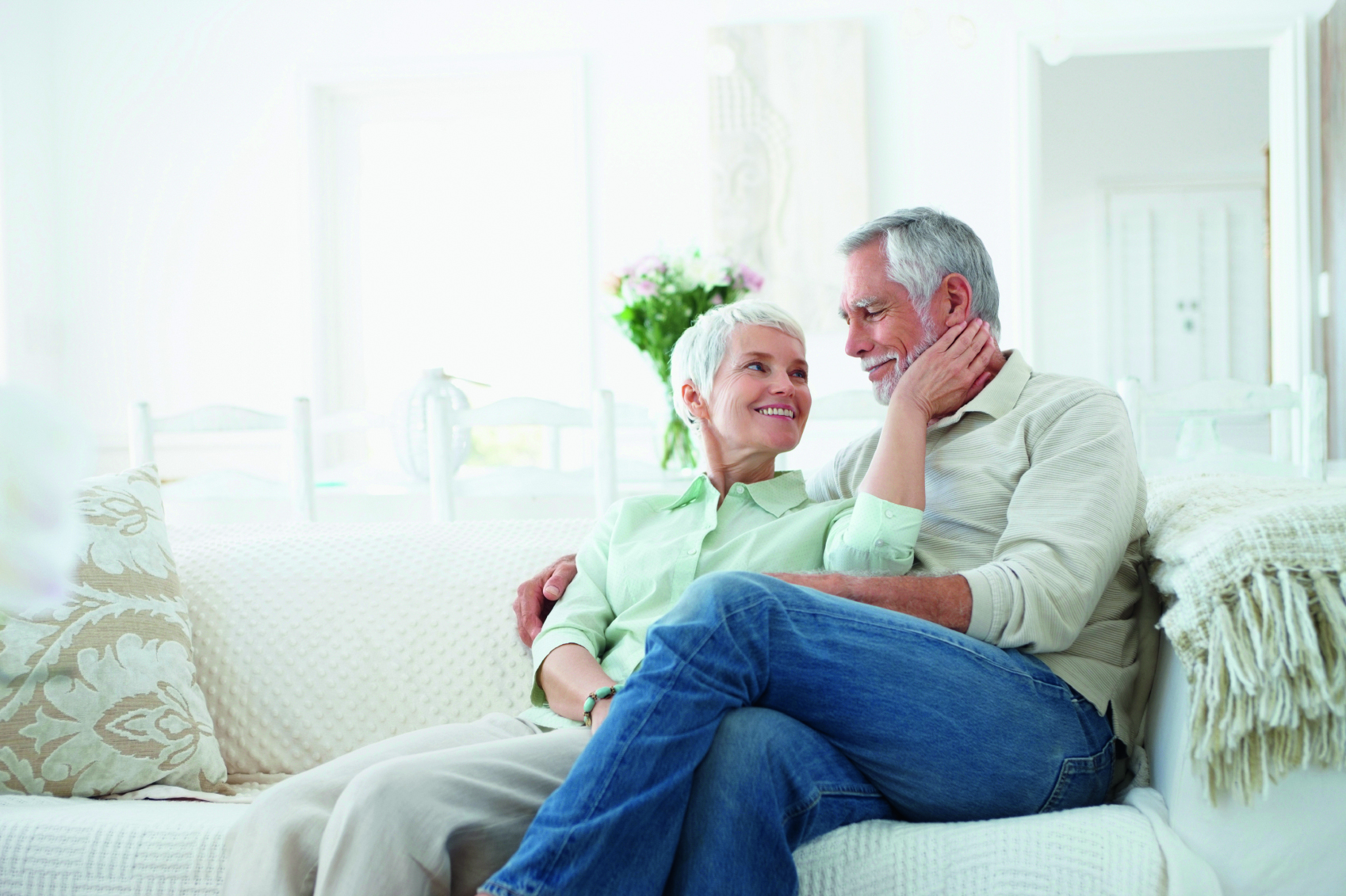 Older Couple Cuddling on Couch