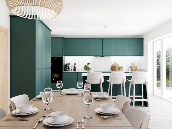 Contemporary kitchen with green cabinets, white island and stools, wooden dining table set with plates and glasses, bright open space.