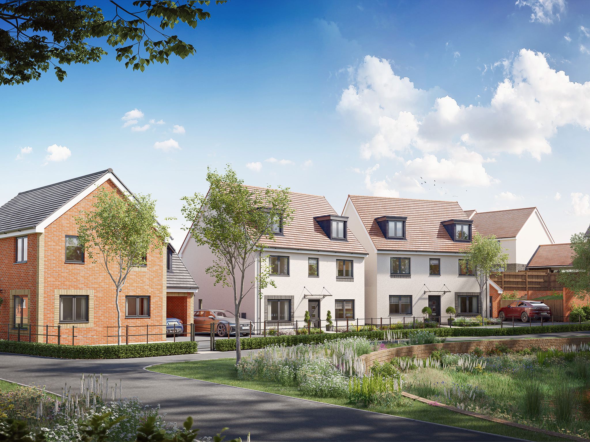 Exterior view of a modern new build development with footpaths and landscaped public areas