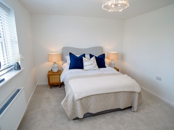 Styled double bedroom in the Greenwood at Trehenlis Gardens.