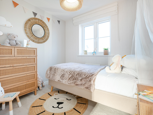 Kids bedroom with single bed and lion theme decor