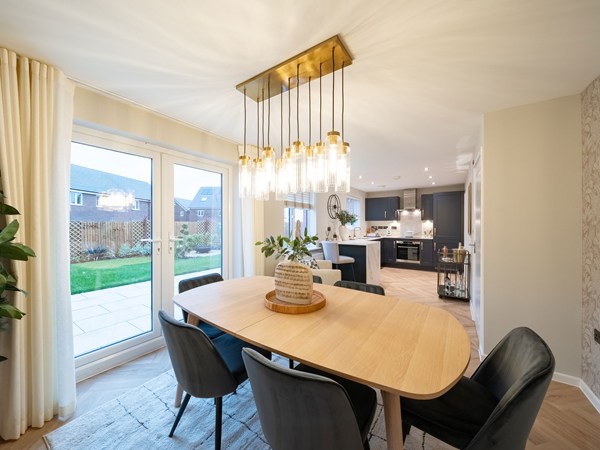 Kielder dining area with six-seater table and garden doors