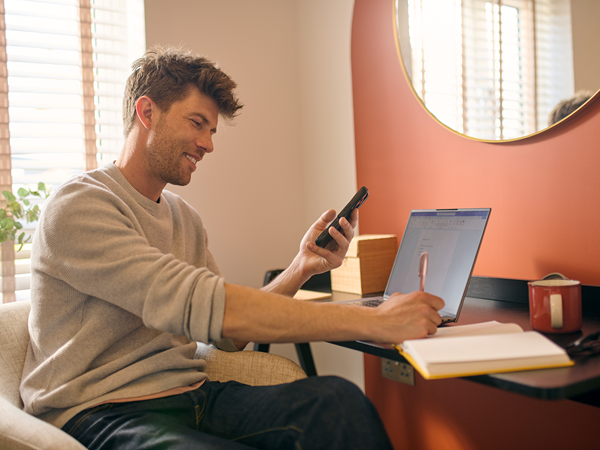 Smiling man in modern home office