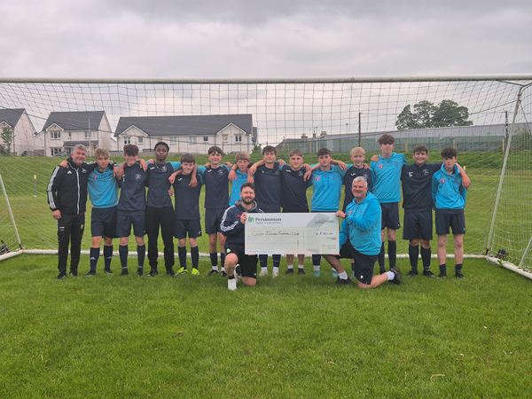 Crieff Juniors holding up Persimmon cheque
