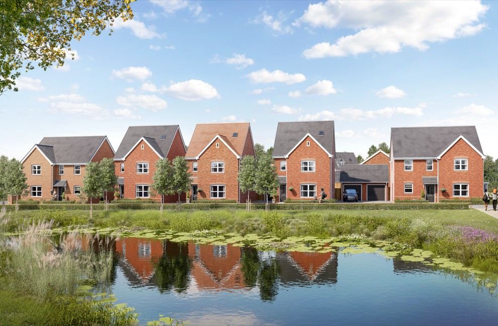 Street scene of red brick new build homes overlooking a pond