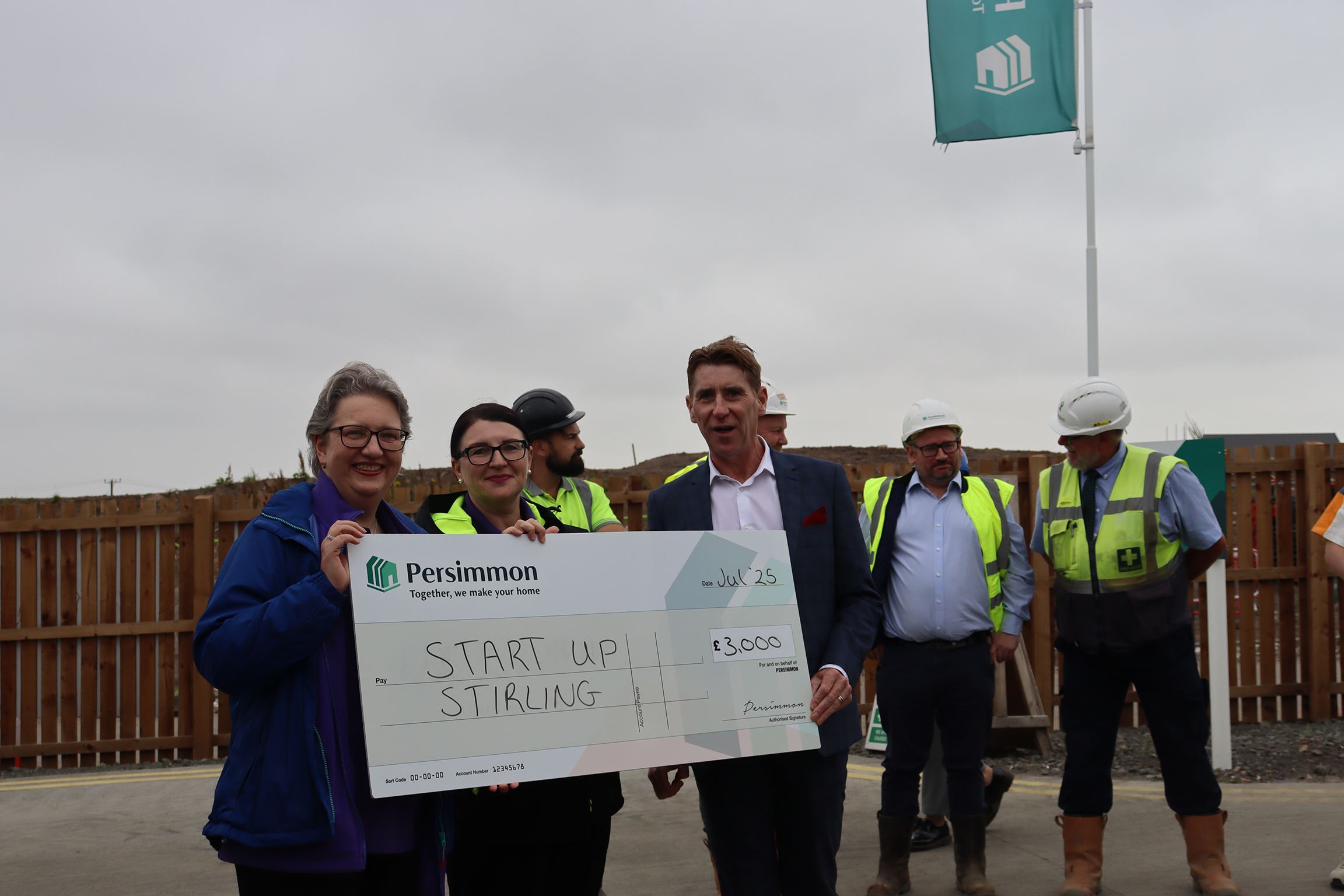 Kevin Ferris presenting Start up Stirling with the cheque.