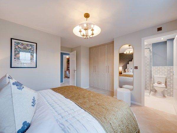 Kielder bedroom with fitted wardrobes and adjoining en suite