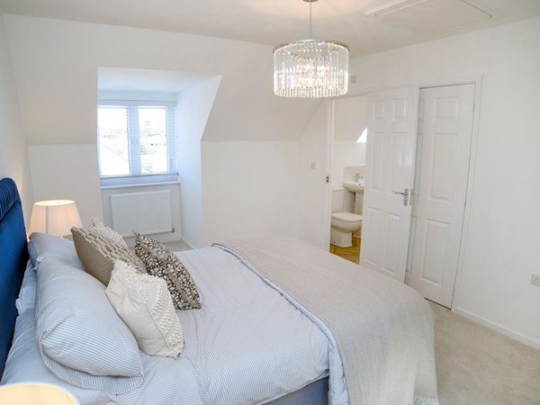 Double bedroom with en suite access in the Greenwood at Trehenlis Gardens.