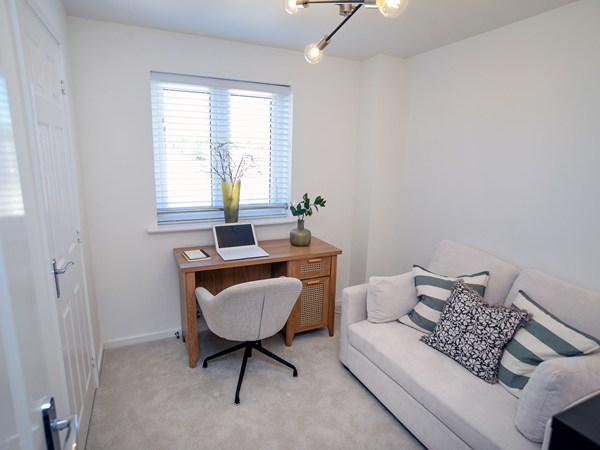 Bedroom arranged as a study in the Greenwood at Trehenlis Gardens.