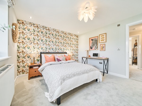 Bright double bedroom with feature wallpaper at Persimmon Homes The Maples development in Bewdley, Worcestershire